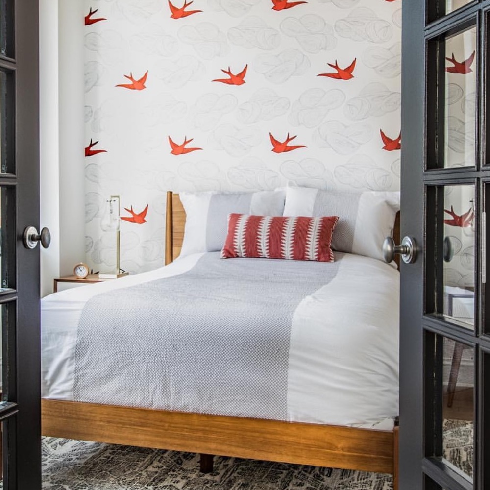 unopened roll of Hygge and West wallpaper in Orange